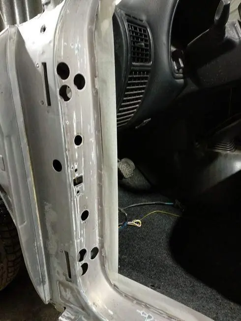 View of the front door opening with adhesive tape glued around the perimeter - rear view