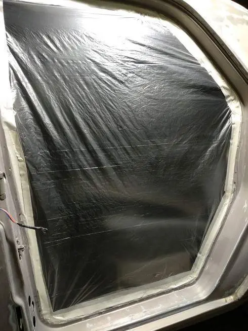 View of the rear door opening with stretched film - front view
