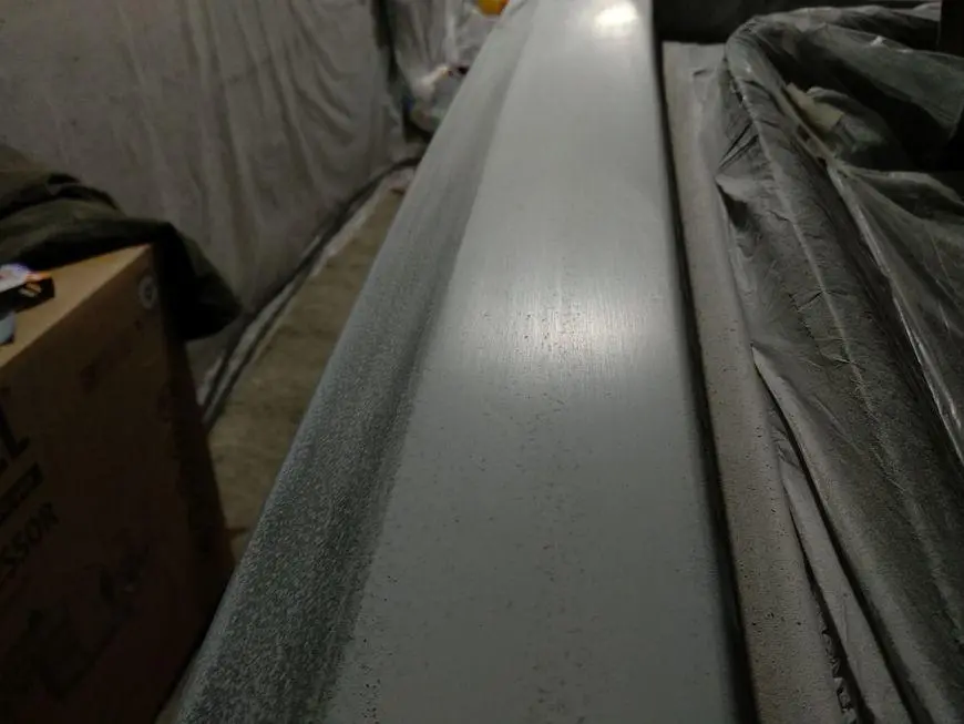 View of the upper surface of the rear wing during grinding