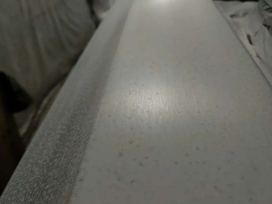 An enlarged view of the upper surface of the rear wing during sanding