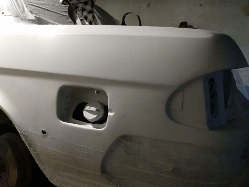View of the back of the rear left fender after sanding