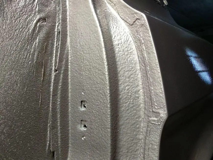 Looking at the back of the doorway of the rear left door