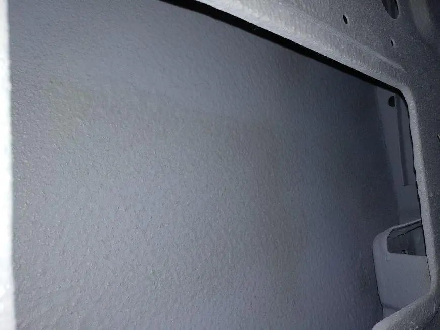 Enlarged view through the technological hole on the internal cavities of the door