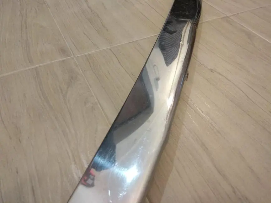 Undamaged part on the middle part of the rear bumper lining