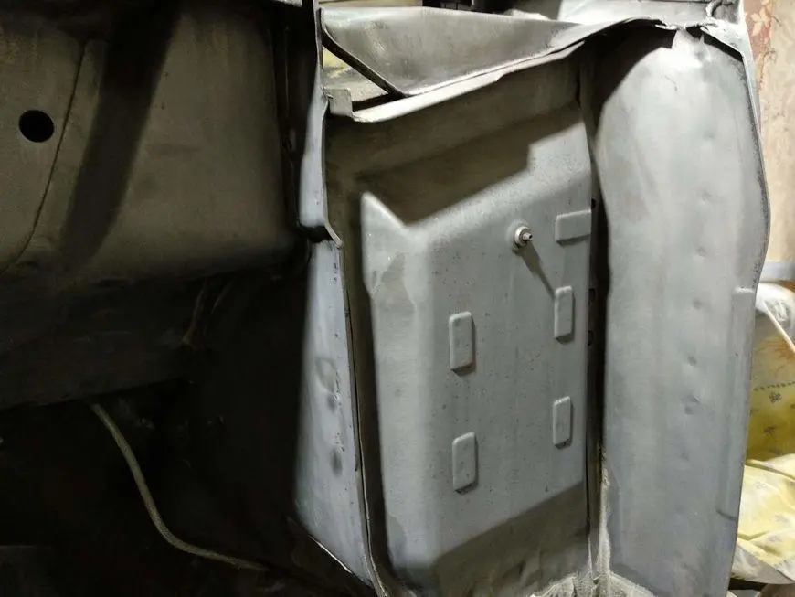 The rear of the mudguard treated a second time with a rust converter and cleaned of acid